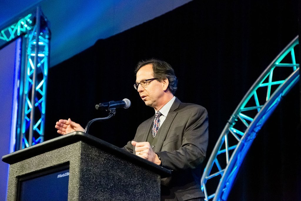 speaker at a lectern during a Washington DC conference